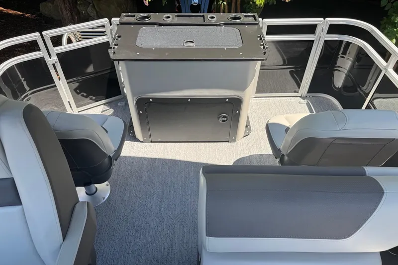 Slide: The Image of 2026 Sun Tracker Fishin' Barge 20 DLX interior with seating and storage area. - 9