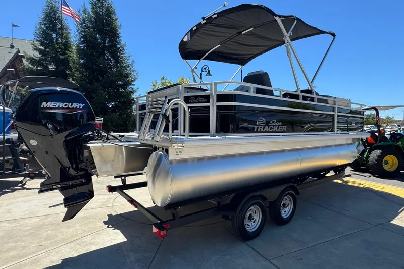 Slide: The Image of 2026 Sun Tracker Fishin' Barge 20 DLX pontoon boat with Mercury engine on trailer. - 5