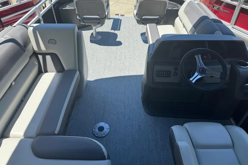 Slide: The Image of Interior of 2026 Sun Tracker Fishin' Barge 20 DLX pontoon boat with seating and steering console. - 11