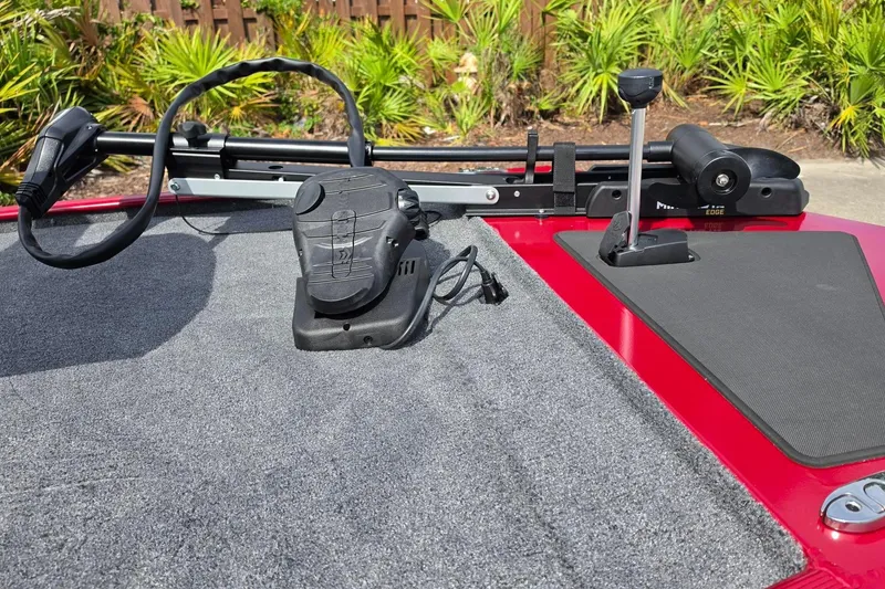 Slide: The Image of 2026 Tracker Bass Tracker Classic XL boat deck with trolling motor and foot pedal. - 13