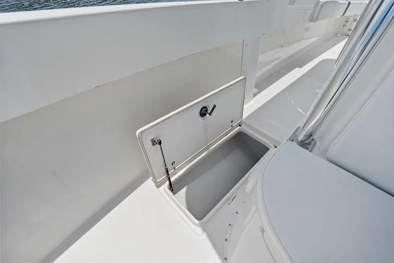 Slide: The Image of Storage compartment on a 1997 Venture 34 Center Console boat deck. - 25