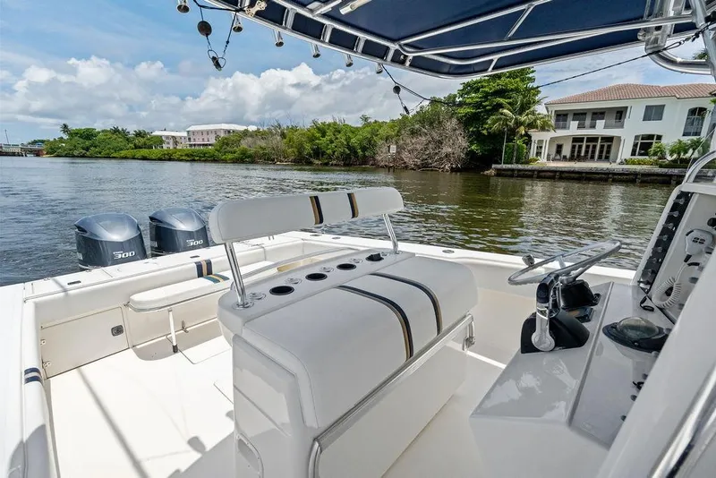 Slide: The Image of 1997 Venture 34 Center Console boat on a scenic waterway with dual engines. - 37