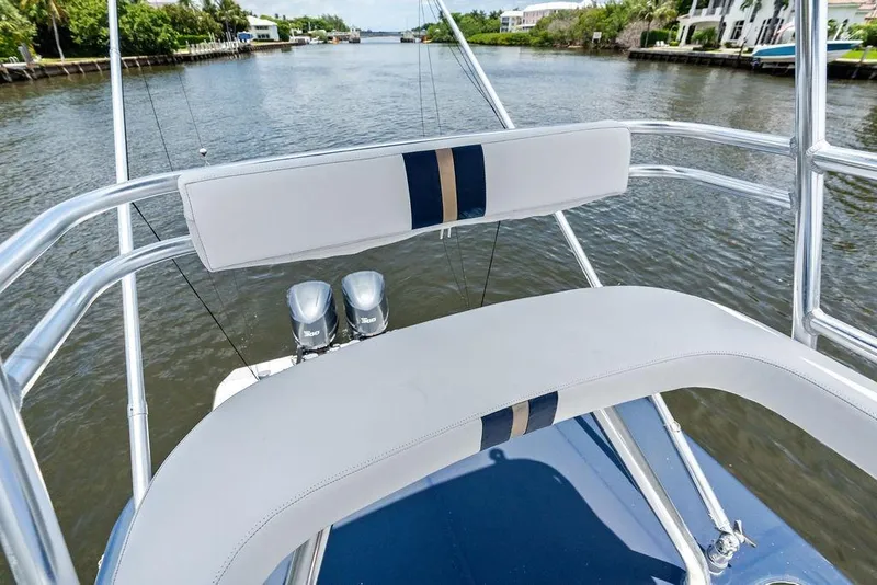 Slide: The Image of 1997 Venture 34 Center Console boat with dual engines on a scenic waterway. - 42