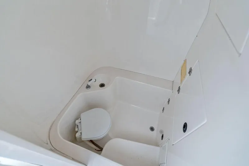 Slide: The Image of Interior view of a 1997 Venture 34 Center Console boat bathroom. - 43