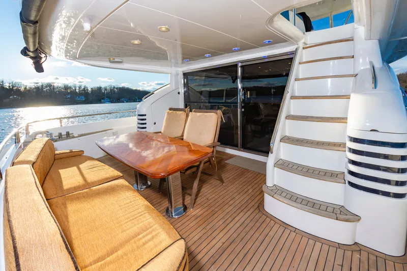 Slide: The Image of Deck area of Princess 75 Yacht with table and seating. - 10