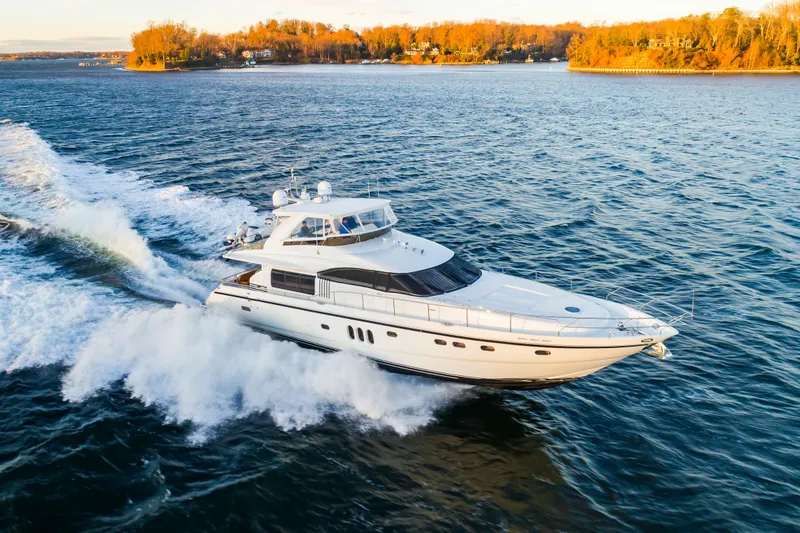 Slide: The Image of 2006 Princess 75 Motor Yacht cruising on water at sunset. - 2