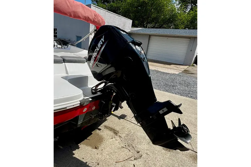 Slide: The Image of 2020 Tahoe T16 boat with Mercury outboard motor in driveway. - 16