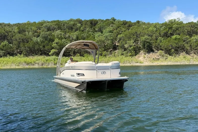 Slide: The Image of 2017 Avalon Catalina Platinum 2585 pontoon boat on a scenic lake. - 10