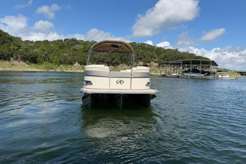Slide: The Image of 2017 Avalon Catalina Platinum 2585 pontoon boat on a scenic lake. - 11