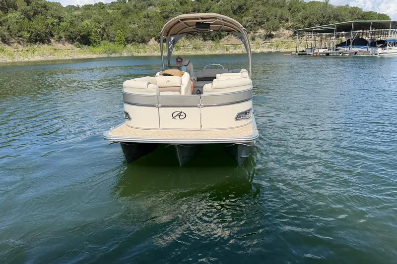 Slide: The Image of 2017 Avalon Catalina Platinum 2585 pontoon boat on a serene lake. - 12