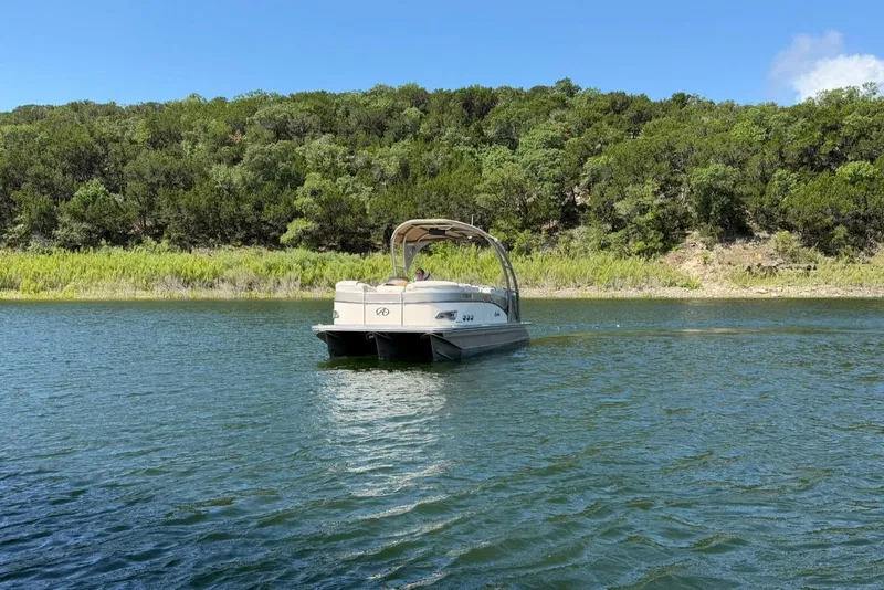 Slide: The Image of 2017 Avalon Catalina Platinum 2585 pontoon boat on a scenic lake. - 13