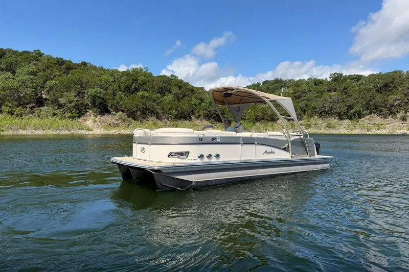 Slide: The Image of 2017 Avalon Catalina Platinum 2585 pontoon boat on a scenic lake. - 15