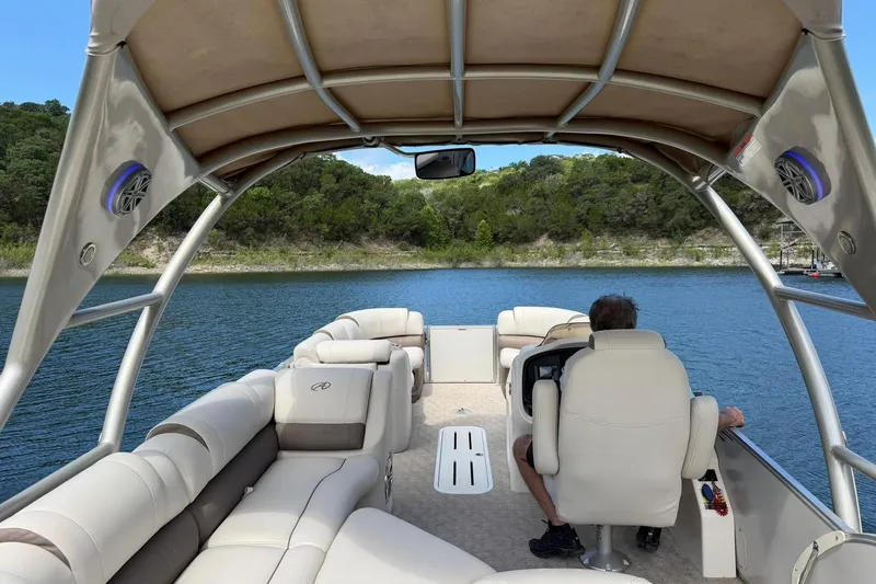 Slide: The Image of 2017 Avalon Catalina Platinum 2585 pontoon boat on a serene lake. - 23