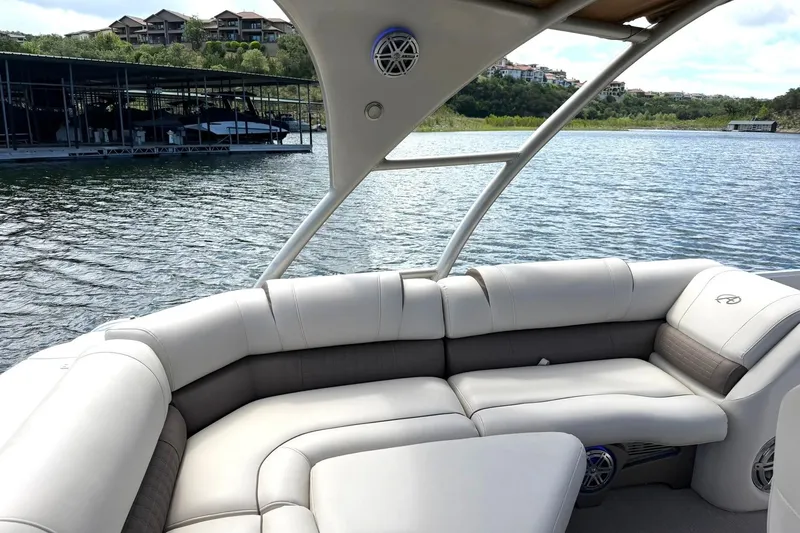 Slide: The Image of Luxurious seating on a 2017 Avalon Catalina Platinum 2585 pontoon boat by the water. - 26