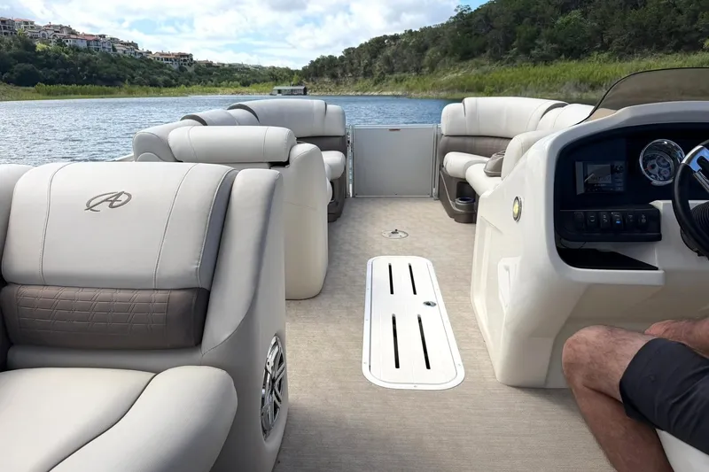 Slide: The Image of Luxurious interior of 2017 Avalon Catalina Platinum 2585 pontoon boat on a scenic lake. - 28