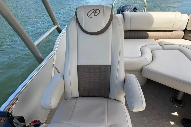 Slide: The Image of 2017 Avalon Catalina Platinum 2585 boat interior with luxurious seating on water. - 29