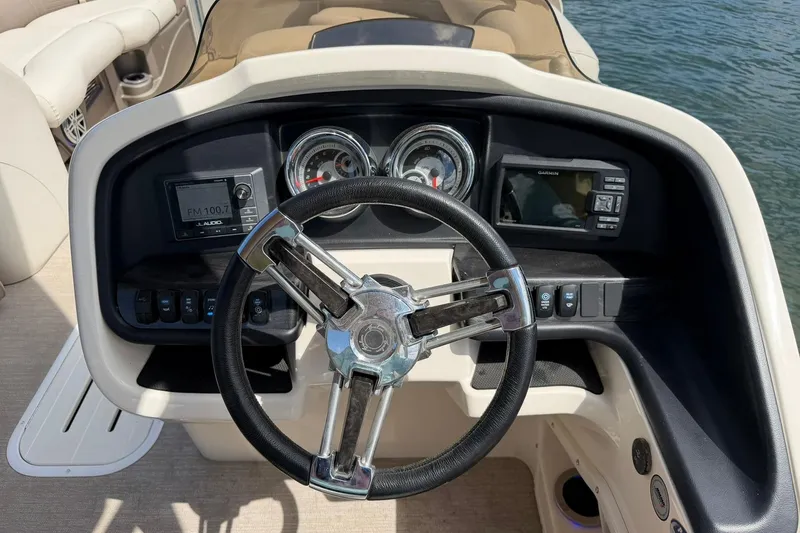 Slide: The Image of Steering console of 2017 Avalon Catalina Platinum 2585 boat with gauges and controls. - 31
