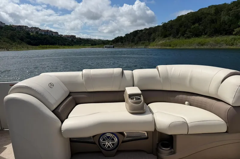 Slide: The Image of Luxurious seating on a 2017 Avalon Catalina Platinum 2585 pontoon boat, with scenic lake view. - 37