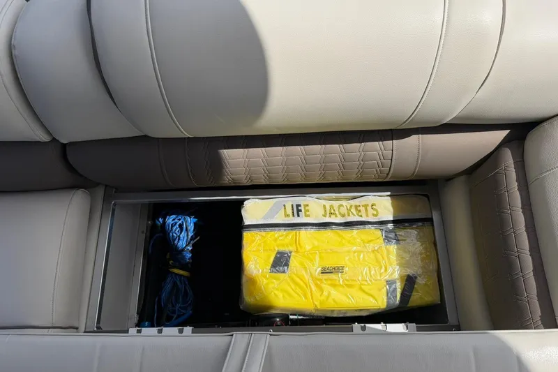 Slide: The Image of Storage compartment in 2017 Avalon Catalina Platinum 2585 with life jackets and rope. - 45