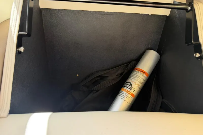Slide: The Image of Storage compartment in a 2017 Avalon Catalina Platinum 2585 with a safety canister inside. - 46