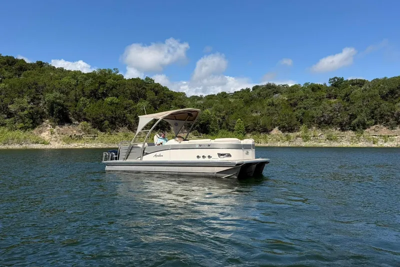 Slide: The Image of 2017 Avalon Catalina Platinum 2585 pontoon boat on a scenic lake. - 6