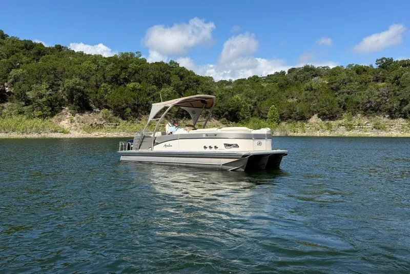 Slide: The Image of 2017 Avalon Catalina Platinum 2585 pontoon boat on a scenic lake. - 8