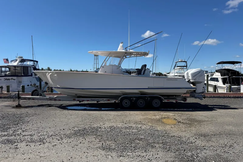 The Image of 2021 Valhalla Boatworks V-33 on trailer at marina, clear sky background. - 0