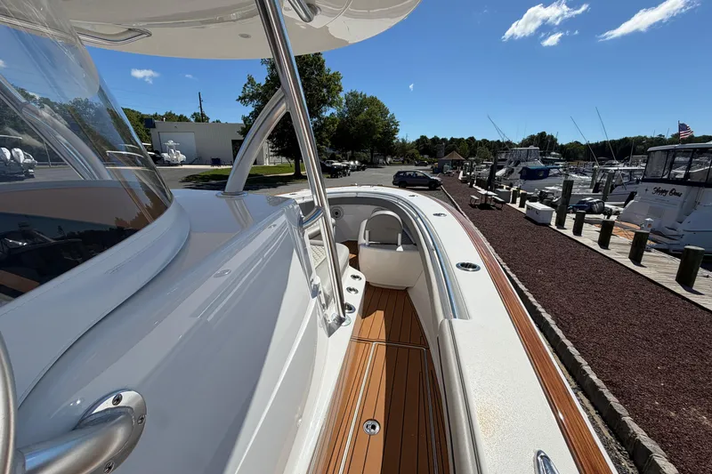Slide: The Image of 2021 Valhalla Boatworks V-33 docked, showcasing sleek design and spacious deck. - 10