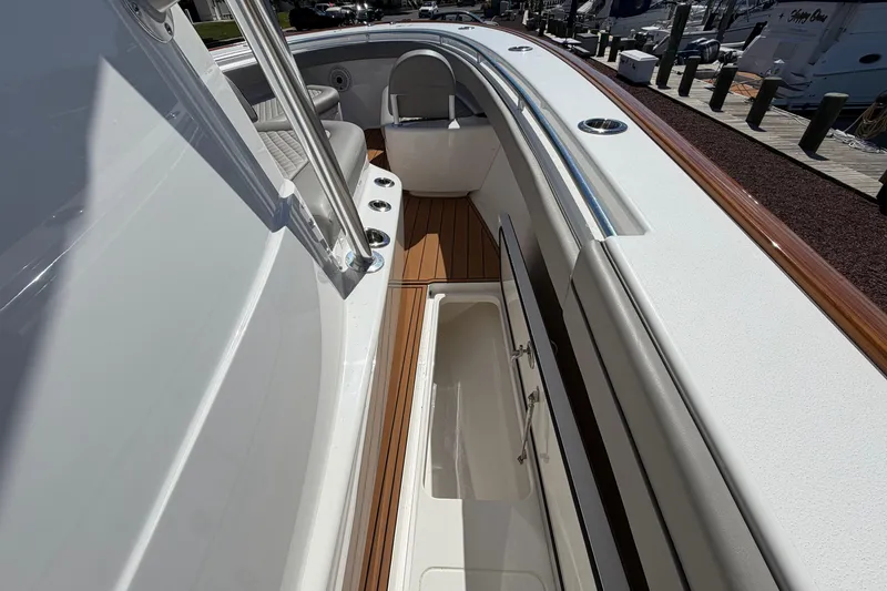 Slide: The Image of 2021 Valhalla Boatworks V-33 interior with open storage compartment and sleek design. - 11