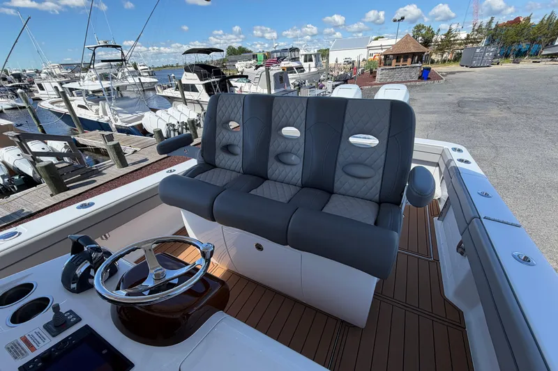 Slide: The Image of 2021 Valhalla Boatworks V-33 helm with luxurious seating at marina. - 16