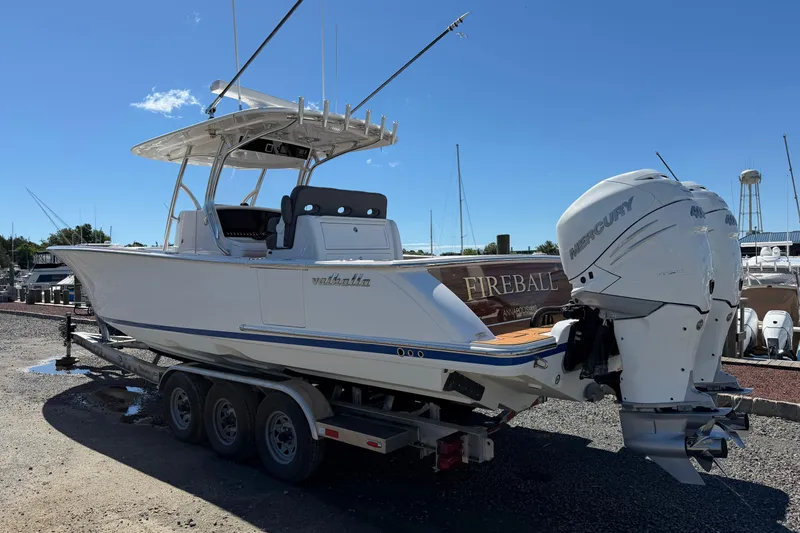 Slide: The Image of 2021 Valhalla Boatworks V-33 on trailer with twin Mercury outboards. - 2