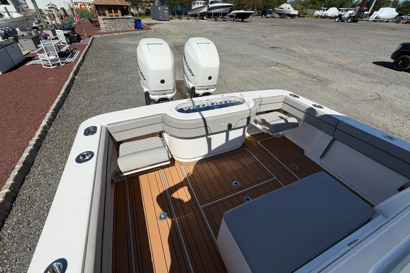 Slide: The Image of 2021 Valhalla Boatworks V-33 with twin engines, featuring spacious deck and seating area. - 24