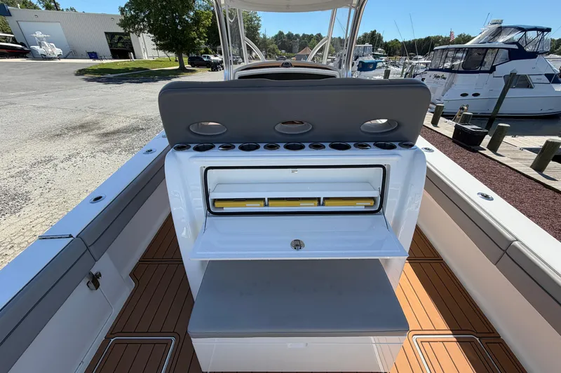 Slide: The Image of 2021 Valhalla Boatworks V-33 center console with rod holders and storage, docked at marina. - 25