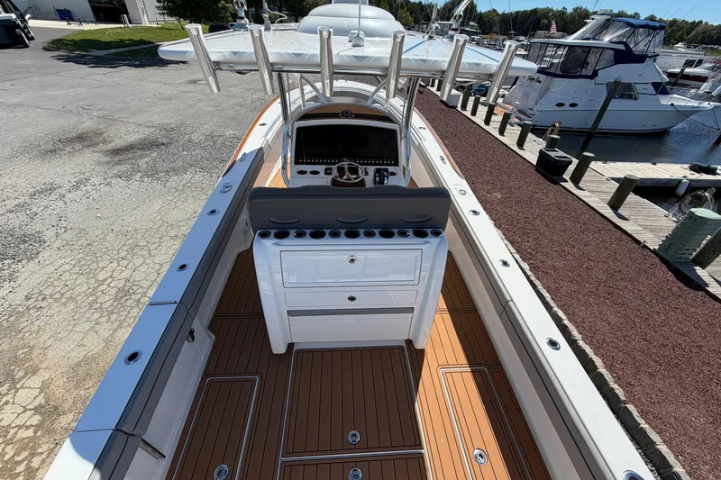 Slide: The Image of 2021 Valhalla Boatworks V-33 with sleek deck design, docked at marina. - 26
