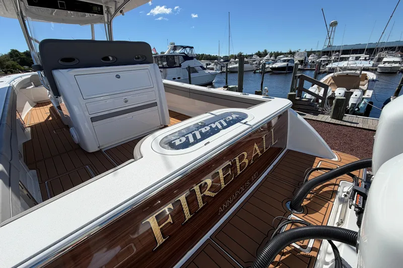 Slide: The Image of 2021 Valhalla Boatworks V-33 "Fireball" docked at marina, featuring sleek design and wood accents. - 27