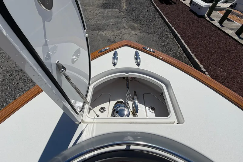 Slide: The Image of 2021 Valhalla Boatworks V-33 anchor compartment with open hatch, showcasing sleek design. - 4