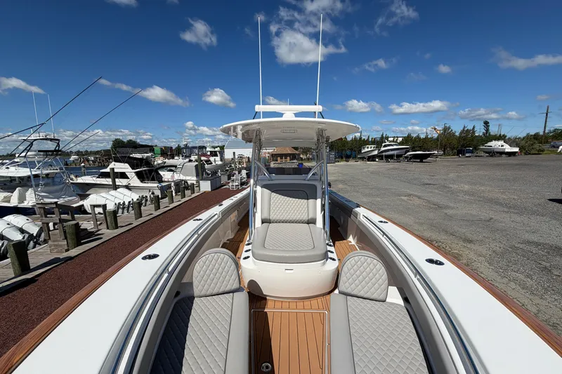 Slide: The Image of 2021 Valhalla Boatworks V-33 at marina, showcasing sleek design and luxurious seating. - 5