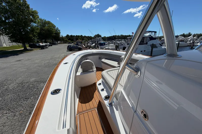 Slide: The Image of 2021 Valhalla Boatworks V-33 at marina, showcasing sleek design and spacious seating. - 9
