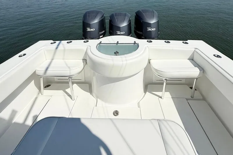 Slide: The Image of 2015 Onslow Bay boat deck with triple 300 horsepower engines and seating area. - 16