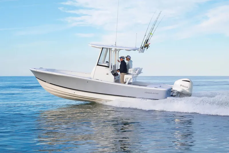 The Image of 2027 Regulator 24XO boat cruising on open water with two people onboard. - 0