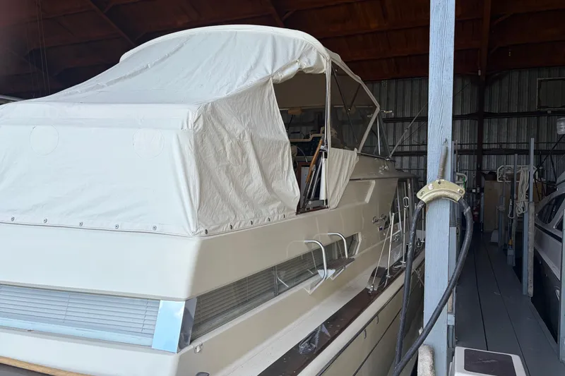 Slide: The Image of 1971 Chris-Craft 42 Commander yacht in storage with protective cover. - 10