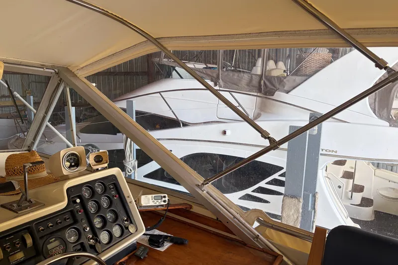 Slide: The Image of Interior view of a 1971 Chris-Craft 42 Commander yacht with dashboard controls. - 13