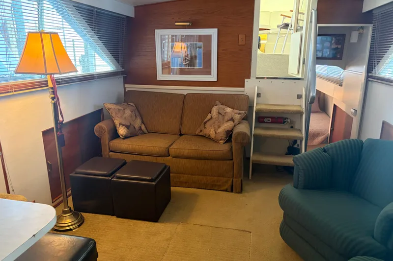Slide: The Image of Interior of a 1971 Chris-Craft 42 Commander yacht with cozy seating and decor. - 16
