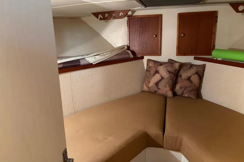 Slide: The Image of 1971 Chris-Craft 42 Commander cabin interior with cozy seating and decorative pillows. - 23