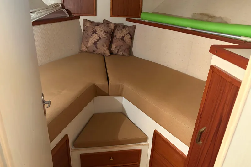 Slide: The Image of 1971 Chris-Craft 42 Commander cabin interior with beige cushions and wooden accents. - 24