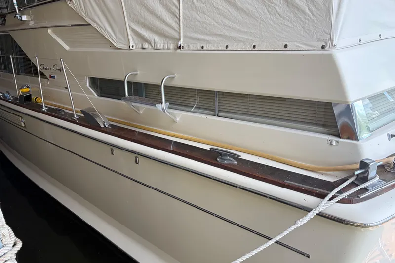 Slide: The Image of 1971 Chris-Craft 42 Commander yacht docked, showcasing classic design and sleek lines. - 4