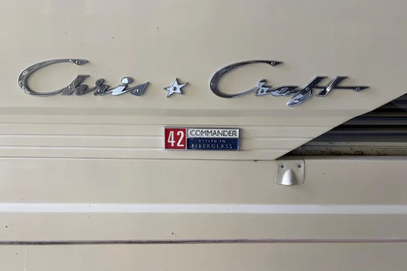 Slide: The Image of 1971 Chris-Craft 42 Commander emblem on fiberglass boat exterior. - 6