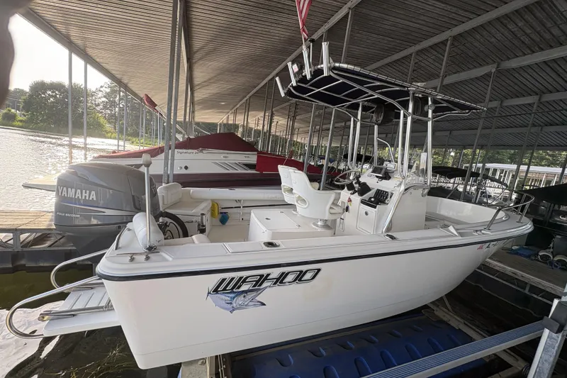 Slide: The Image of 2007 Edgewater 188CC boat docked with Yamaha outboard motor. - 3