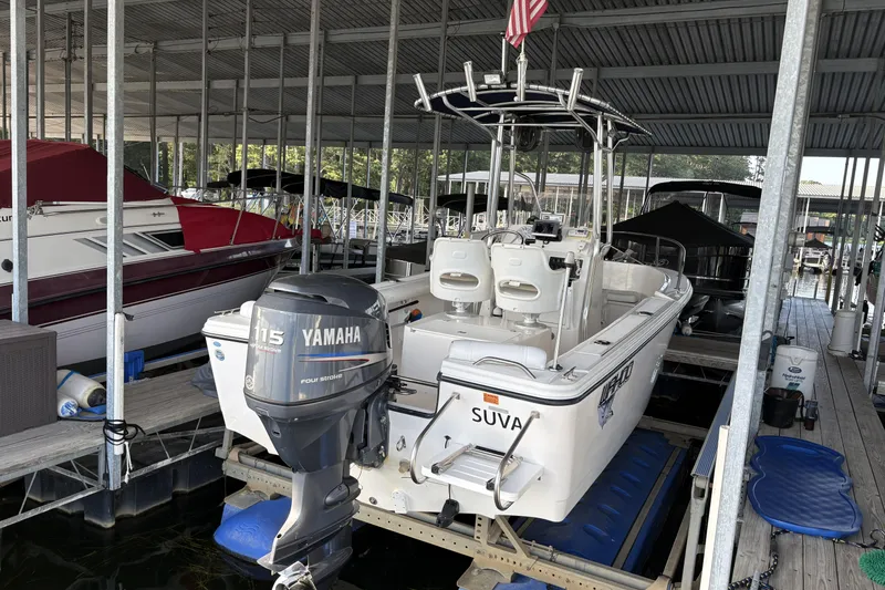 Slide: The Image of 2007 Edgewater 188CC boat with Yamaha 115 engine docked in a marina. - 15