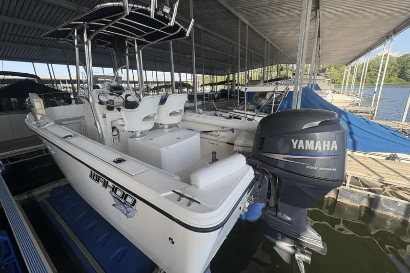 Slide: The Image of 2007 Edgewater 188CC boat with Yamaha outboard motor docked in a marina. - 16